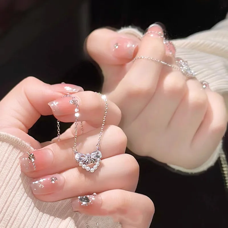 S925 sterling silver love bow pearl necklace female niche light luxury elegant senior sense ins wind explosion models necklace