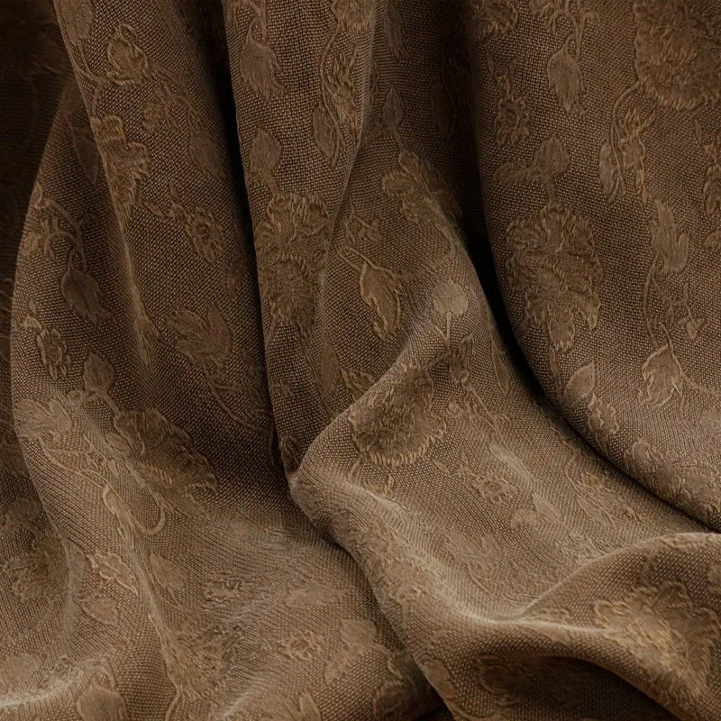 

The fabric of new Chinese-style cheongsam is made silk with entwined perforated and fragrant gauze It yellow brown