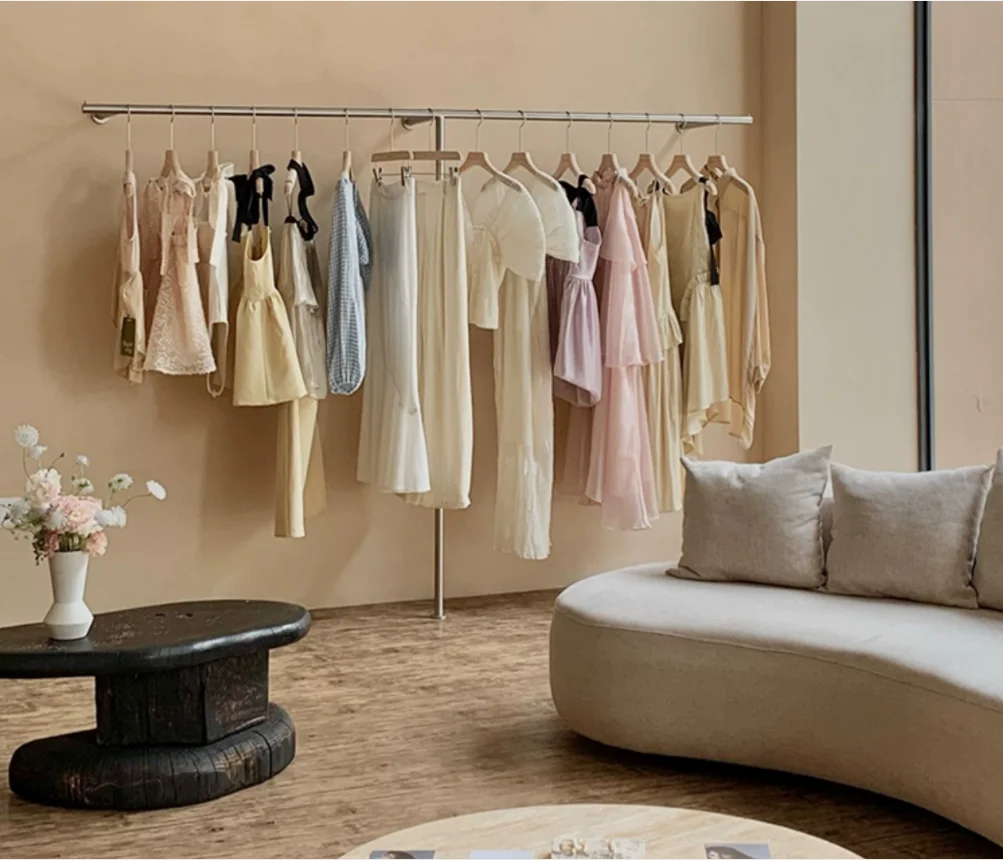 

Stainless steel display rack on the wall of the clothing store, hanging clothes rack, wall mounted women's clothing store shelf,