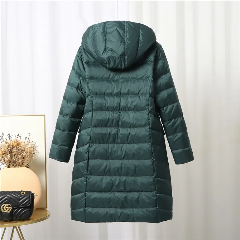 Nueva chaqueta de plumón cálida de lujo para mujer, abrigo de invierno con capucha de longitud media de talla grande, ropa de abrigo Reversible ligera