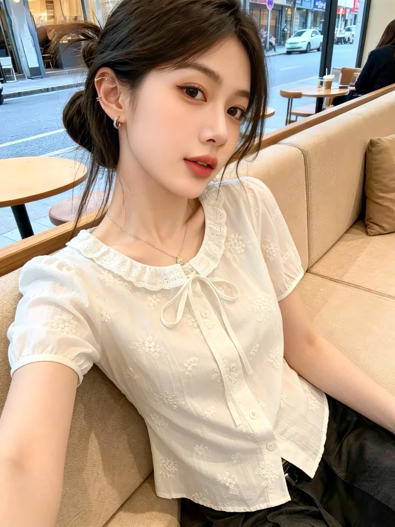 

Korean Style Sweet Embroidered Blouse Women's Summer New Knot Shirt Self-Reserve Bubble Sleeve Short Sleeve round Neck