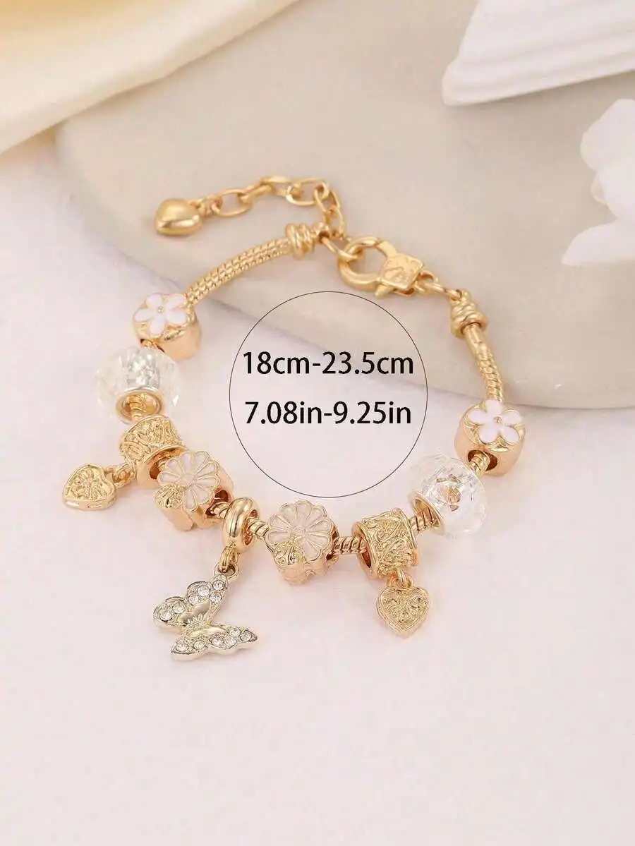 

Gold-Tone Resin Charm Bracelet Featuring Butterfly, Floral, And Heart Dangles For Women, Adjustable 18-23.5Cm