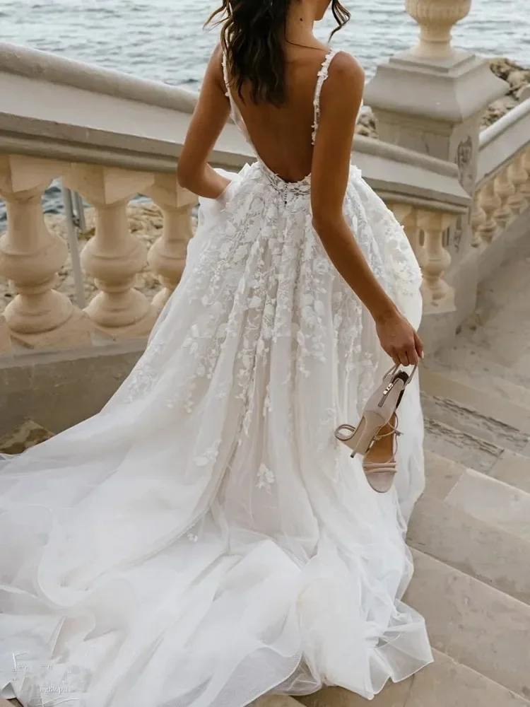 Sexy and Elegant, Deep V-Neck Gown featuring Sheer Tulle and Lace Appliqués — An Open-Back Wedding Dress with a Seaside Vibe