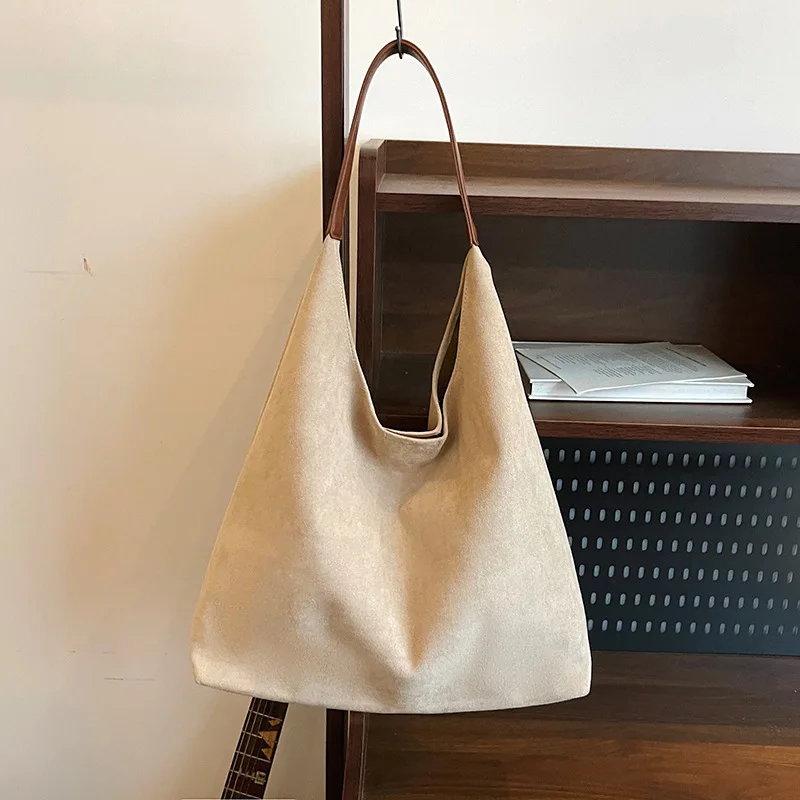 

The Statement Tote for 2025. A uniquely designed, spacious shoulder bag for expressive style and cool-weather comfort.