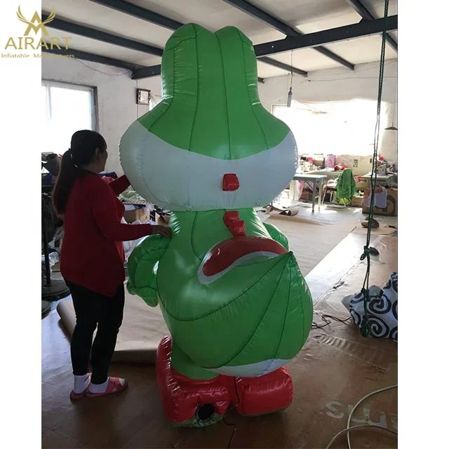 Green cartoon inflatable miniature dinosaur monster