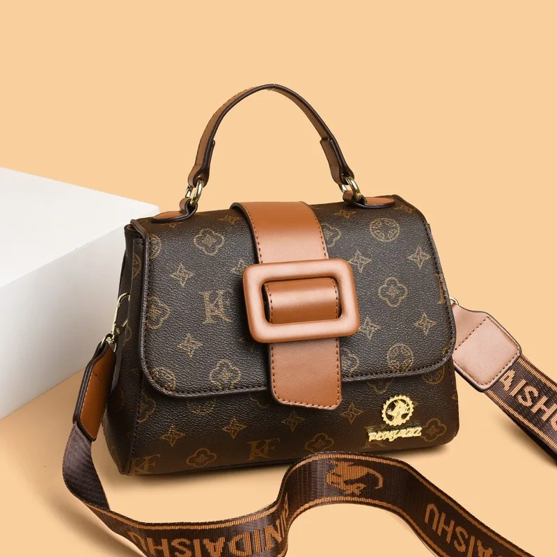 

Стильная дизайнерская сумка для подгузников, элегантная кожаная сумка через плечо для женщин, стильная текстурированная сумка-тоут.