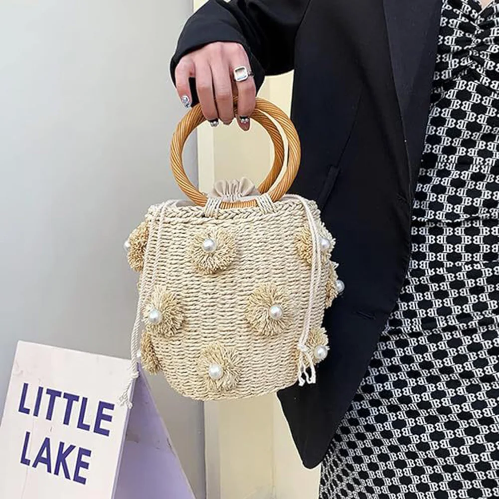 

Women's Handmade Woven Straw Bag with Pearls Drawstring Wrist Purse Bohemian Beach Holiday Tote Bag