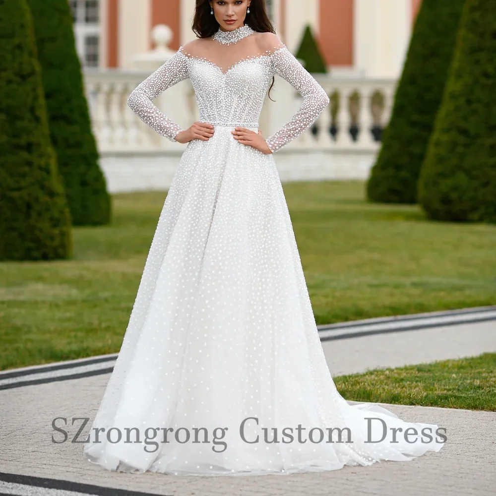 فساتين زفاف مصنوعة حسب الطلب برقبة على شكل حرف a ترتر سباركلي على شكل حرف a من التل بأكمام طويلة مع ذيل فيستدوس دي