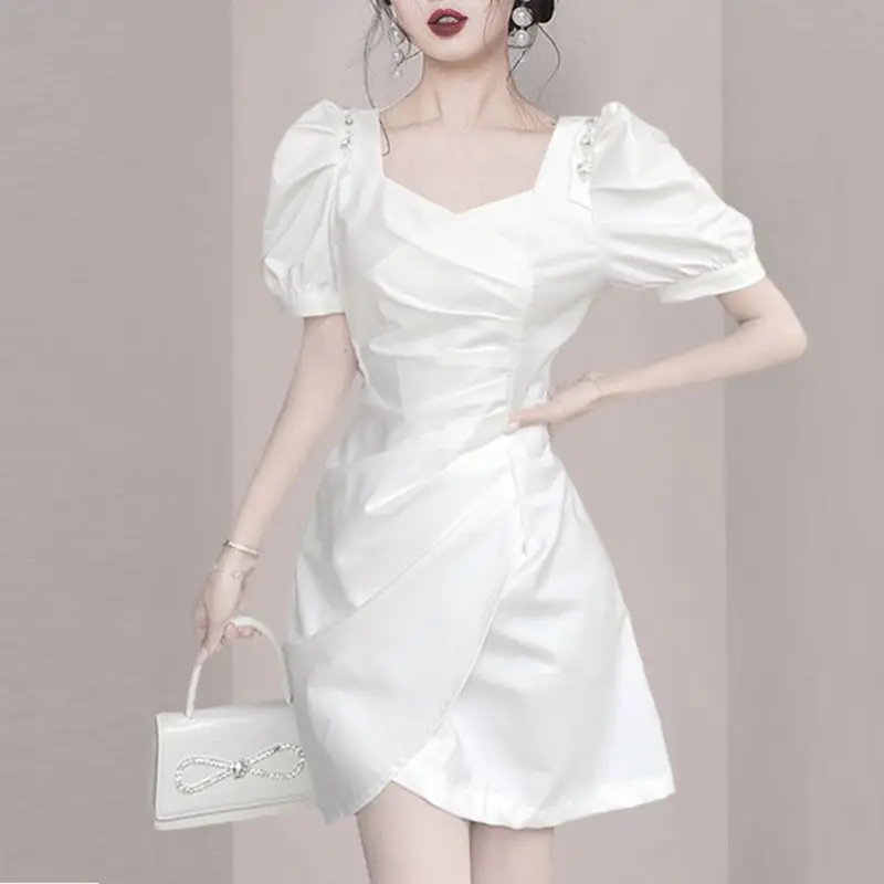 New French dress  summer  2023, with a slim design and a slim waist, small square neck, small black dress