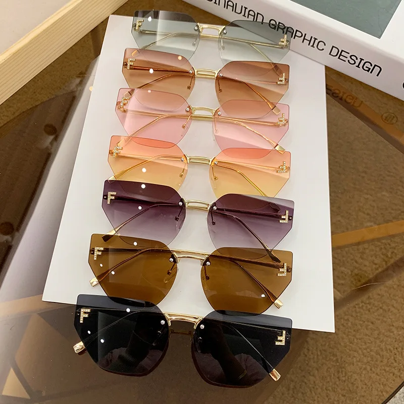 New letter inlaid diamond sunglasses for women with a sense of luxury, frameless cut edge sunglasses, cross-border fashion metal