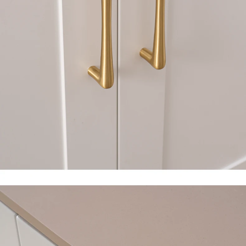 Brass pulls used on matching white cabinet doors