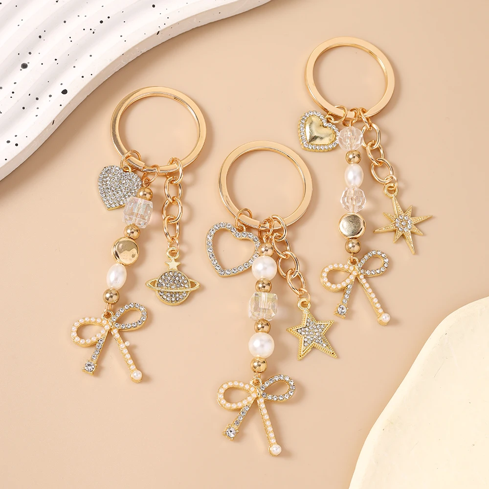 Aihua Exquisiter Schlüsselanhänger in Goldfarbe mit Herz, Stern und Schleife für Damen und Mädchen, Handtaschenanhänger, Dekoration, handgefertigter Schmuck, Geschenke – Detail 1