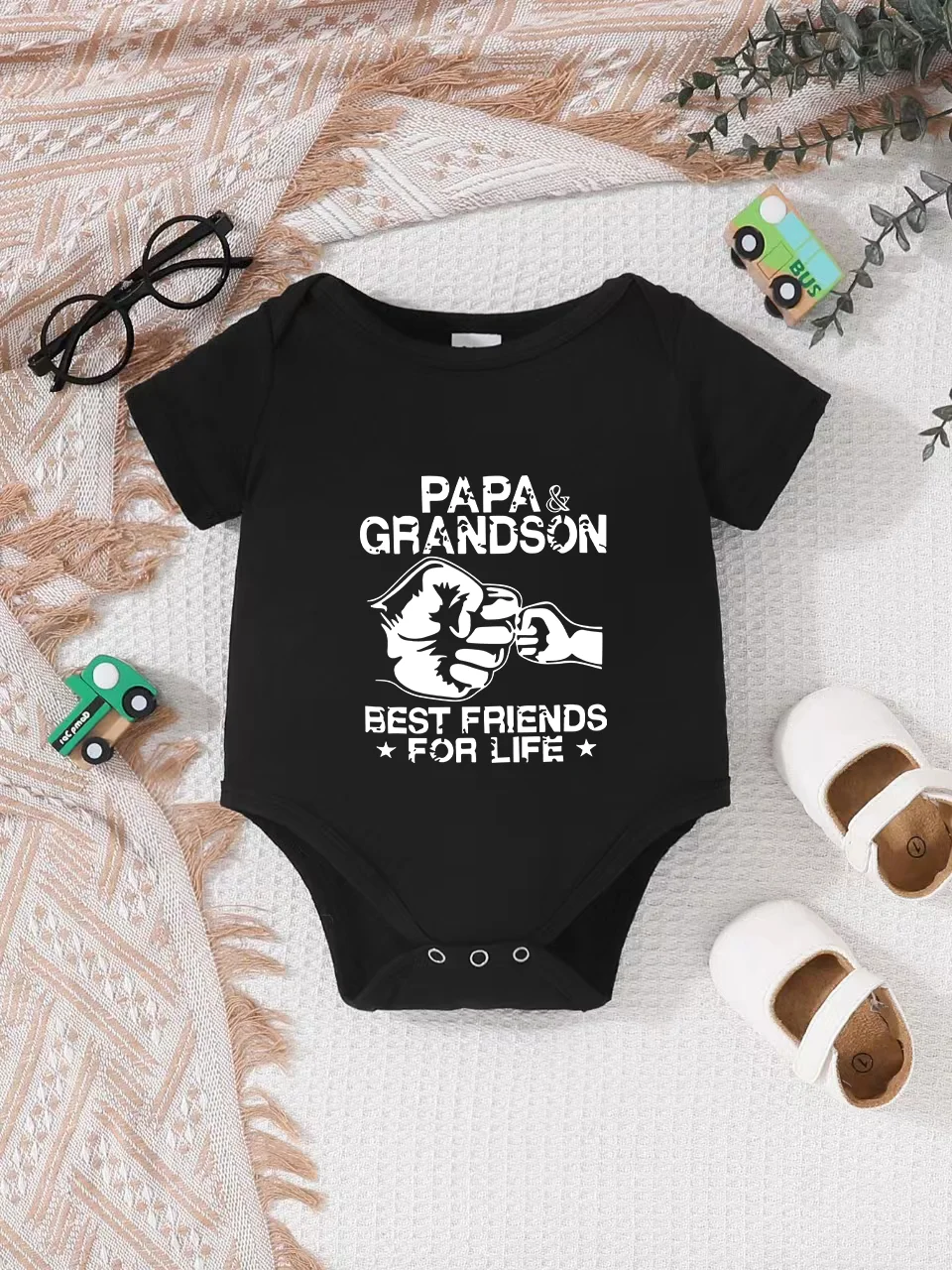 Playful letter-printed baby short-sleeve triangle bodysuit. Button closure for easy dressing, machine washable