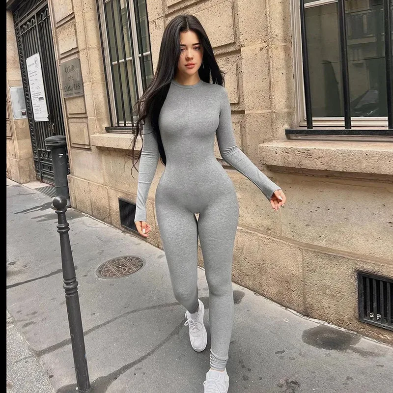

2024 Spring Solid Color Simple Basic Knitted High Elastic Round Neck Long Sleeve Tight Small Foot Jumpsuit For Women