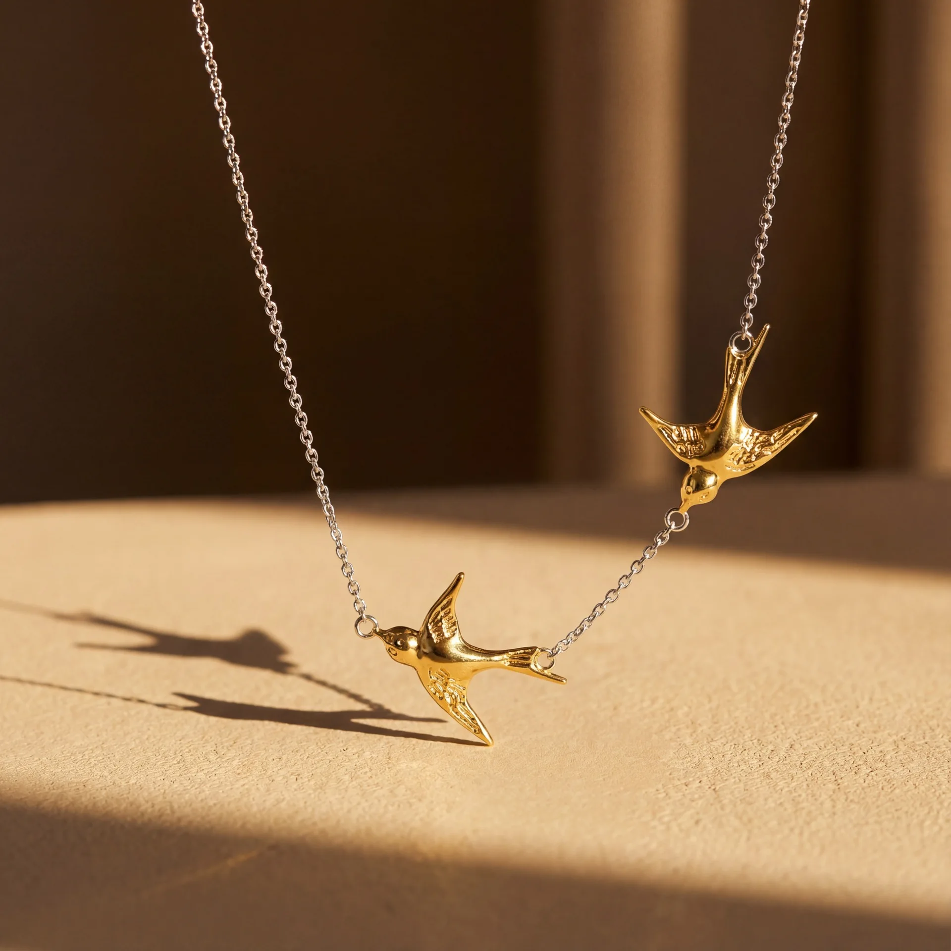 European and American style stainless steel double flying swallow pendant gold and silver spliced necklace women's simple fashio