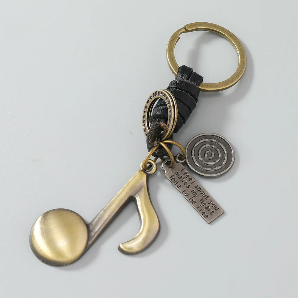 New creative copper-colored musical note instrument alloy keychain, vintage cowhide keychain, music festival pendant, for both m
