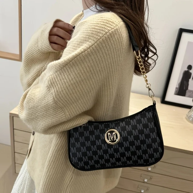 

Classic Pattern Shoulder Bags Round Gold Emblem Adjustable Strap Elegant Design for Daily Commutes Dating Casual Underarm Bag
