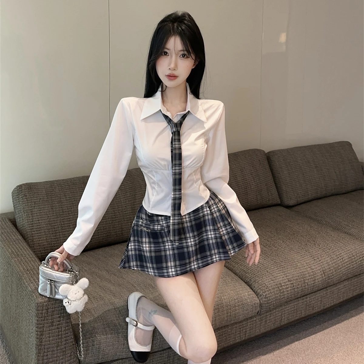 ชุดเซ็ตเสื้อสเวตเตอร์ยาวผูกโบว์พร้อมกระโปรงลายสก็อตสำหรับผู้หญิง แฟชั่นฤดูใบไม้ร่วงฤดูหนาว รุ่นใหม่ล่าสุด