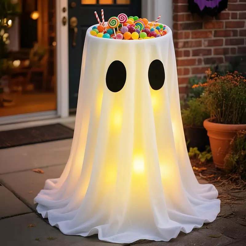 Halloween decorations, glowing ghost lamps, candy tray ornaments, outdoor yard fruit plates, doorway scene decorations