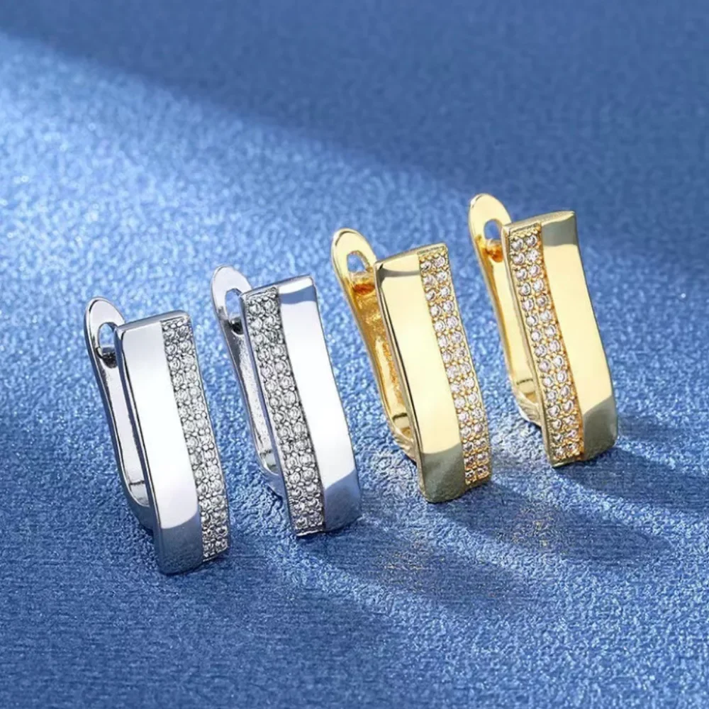 

U-shaped golden earrings. U-shaped metal inlaid with zircon, fashionable and cute women's earrings, new trendy women's jewelry.