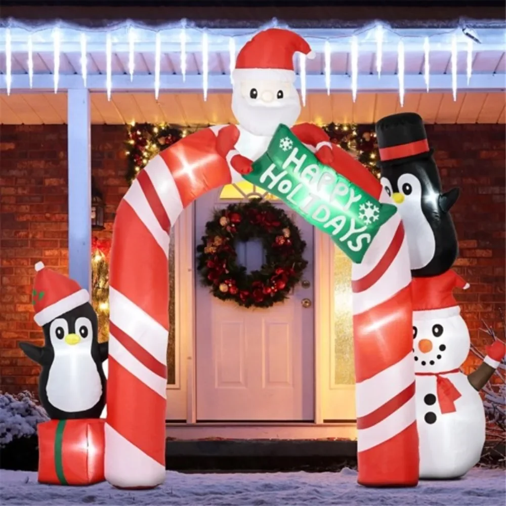 

Christmas inflatable arches with Santa Claus, two penguins, and snowman inflatable toys bind the Christmas display together