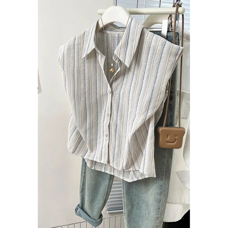 Camicia a righe asimmetrica allentata con bottoni alla moda Abbigliamento femminile 2025 Estate Nuove magliette casual Camicetta da donna senza maniche da ufficio
