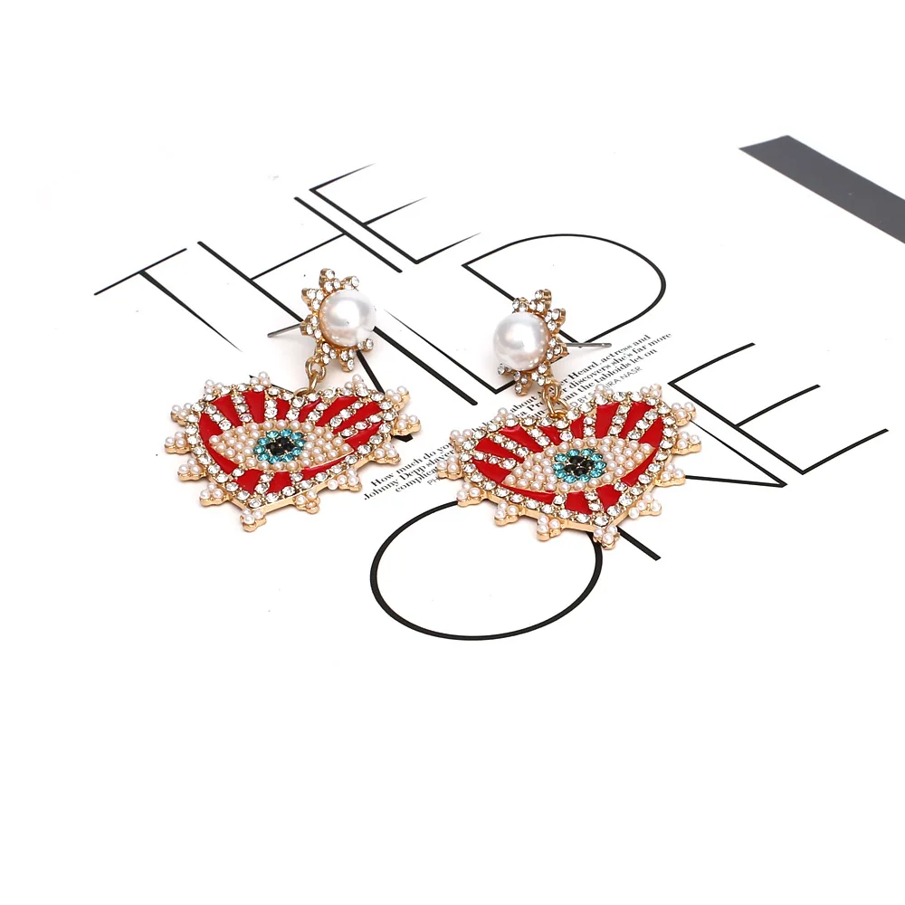 Heart-shaped alloy drip oil inlaid pearl earrings Street shot Devil's Eye rhinestone earrings Earrings Source