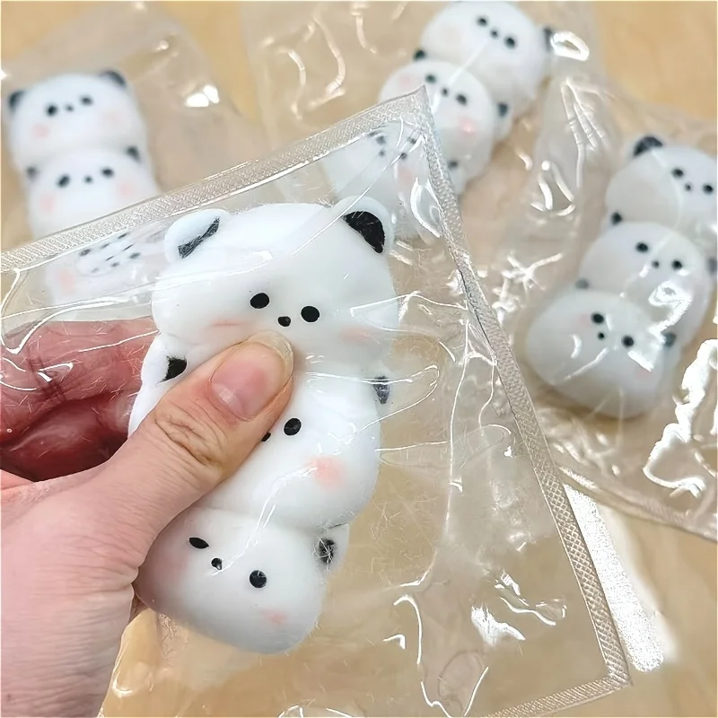 

1 Taba pinch, new red panda head squeeze - unprecedented gameplay. This cute pinch features a black and white color scheme and soft touch, and can be used as office decoration and photography props