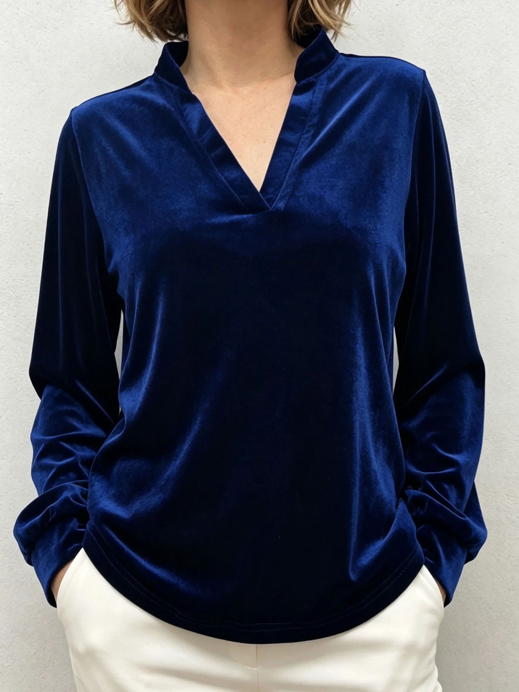 Women's solid-color velvet long-sleeve top featuring a small stand collar with a subtle V-neck; a loose-fitting velvet base laye