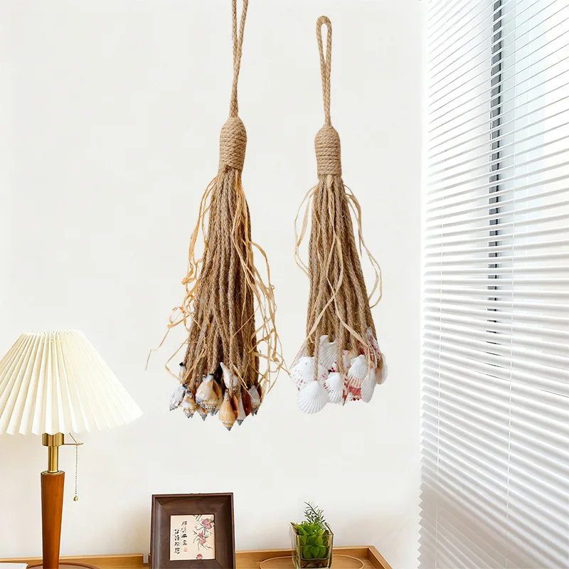 Adorno de pared hecho a mano con cuerda de yute trenzada y flecos de conchas marinas, decoración natural para boutique, hotel u hogar.