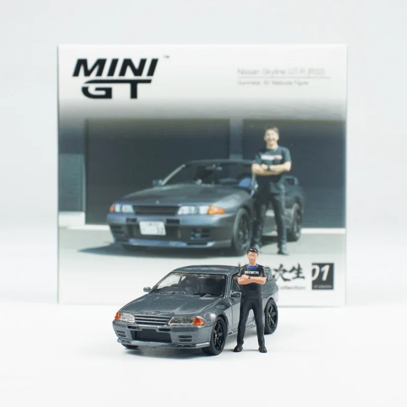 

Коллекционная модель автомобиля MINI GT 1:64 Skyline GTR R32 Gunmetal с фигуркой, литая под давлением, из сплава.