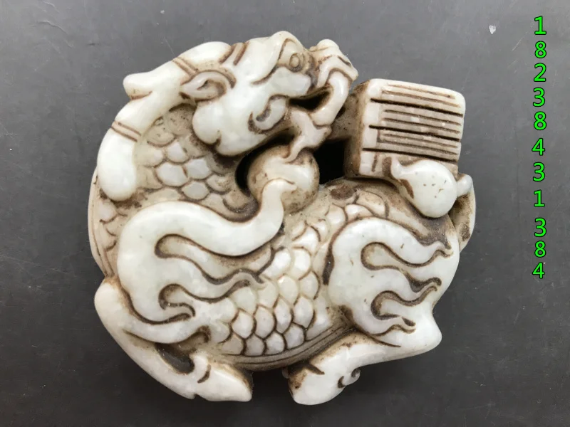 

Old Xiuyu Jade Bi hollow carved jade Bi brand old stone objects pendant hand piece Kirin book.