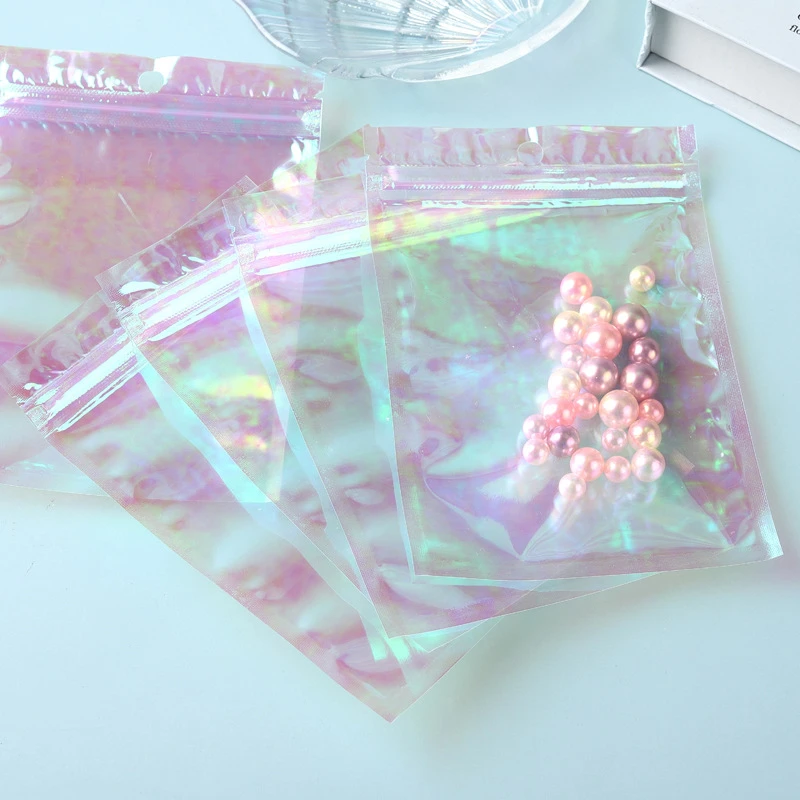 100Pcs/Lot Small Laser Plastic Storage Bags Transparent Pink Stand Up Holographic Ziplock Bag Flat Pouches For Cosmetic Jewelry