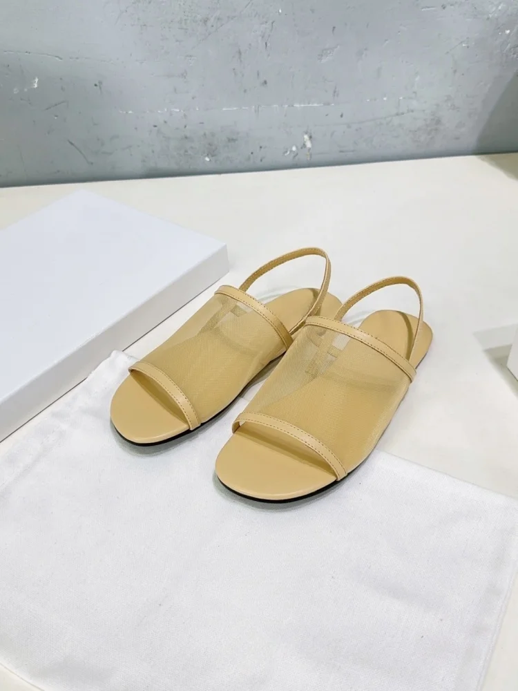 The new women's mesh breathable flat sandals have a simple design, come with lacing straps at the back, and feature open toes fo
