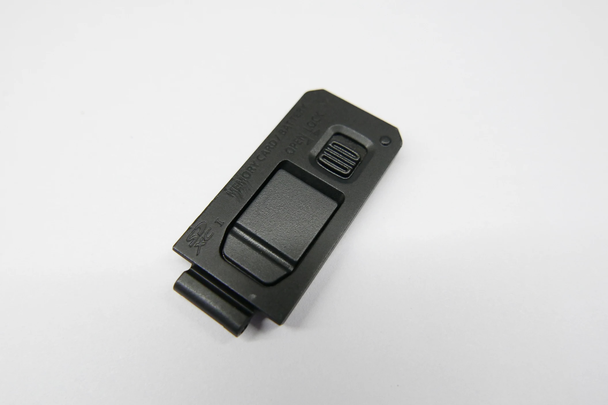Per Panasonic Lumix DMC-LX100 Parte di riparazione del coperchio della serratura del coperchio dello sportello della batteria (nero)