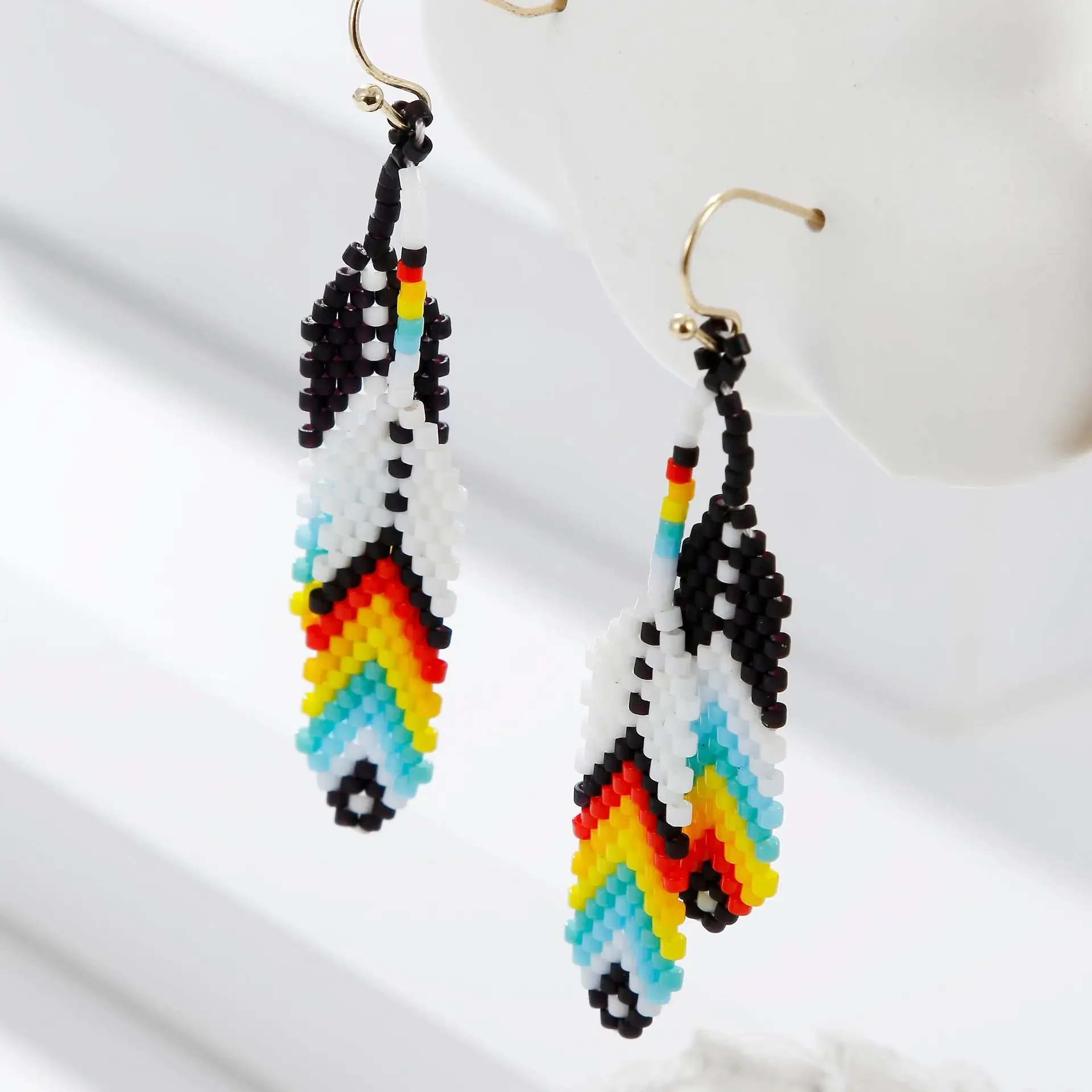 

Tassel Earrings Hand knitting Beaded Color matching petal multi Hawaiian leaf Bohemia alloy ma'am Rice Bead Earrings