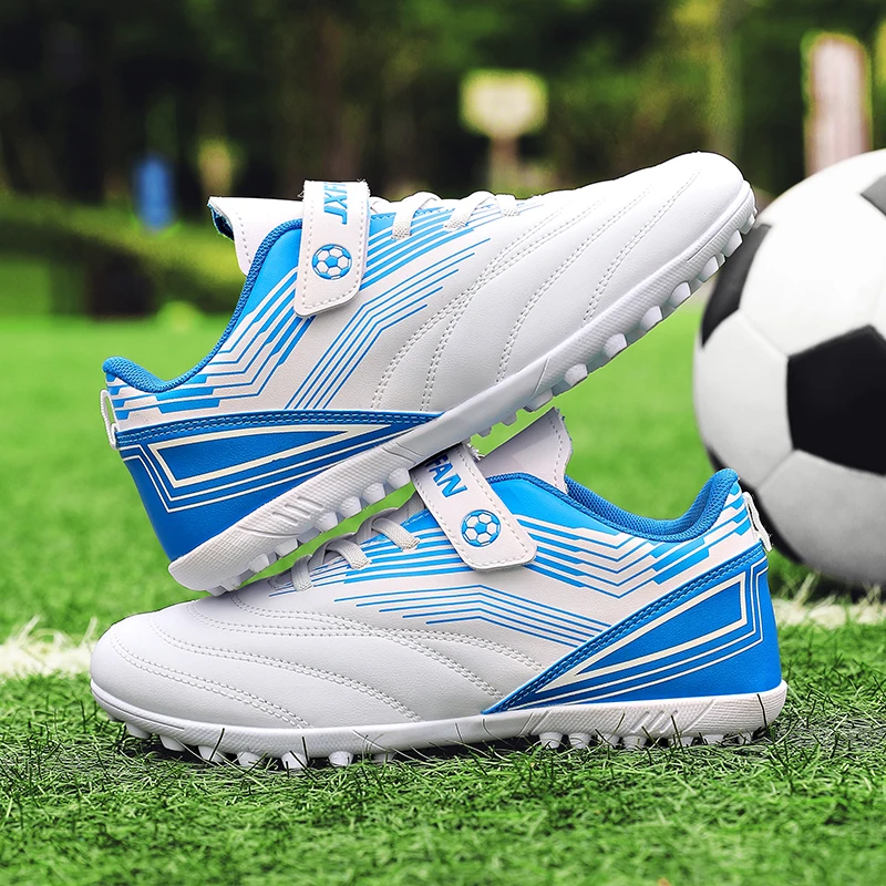 

A pair of children's soccer cleats with hook-and-loop closure non-slip turf sole for training and outdoor use JS-301
