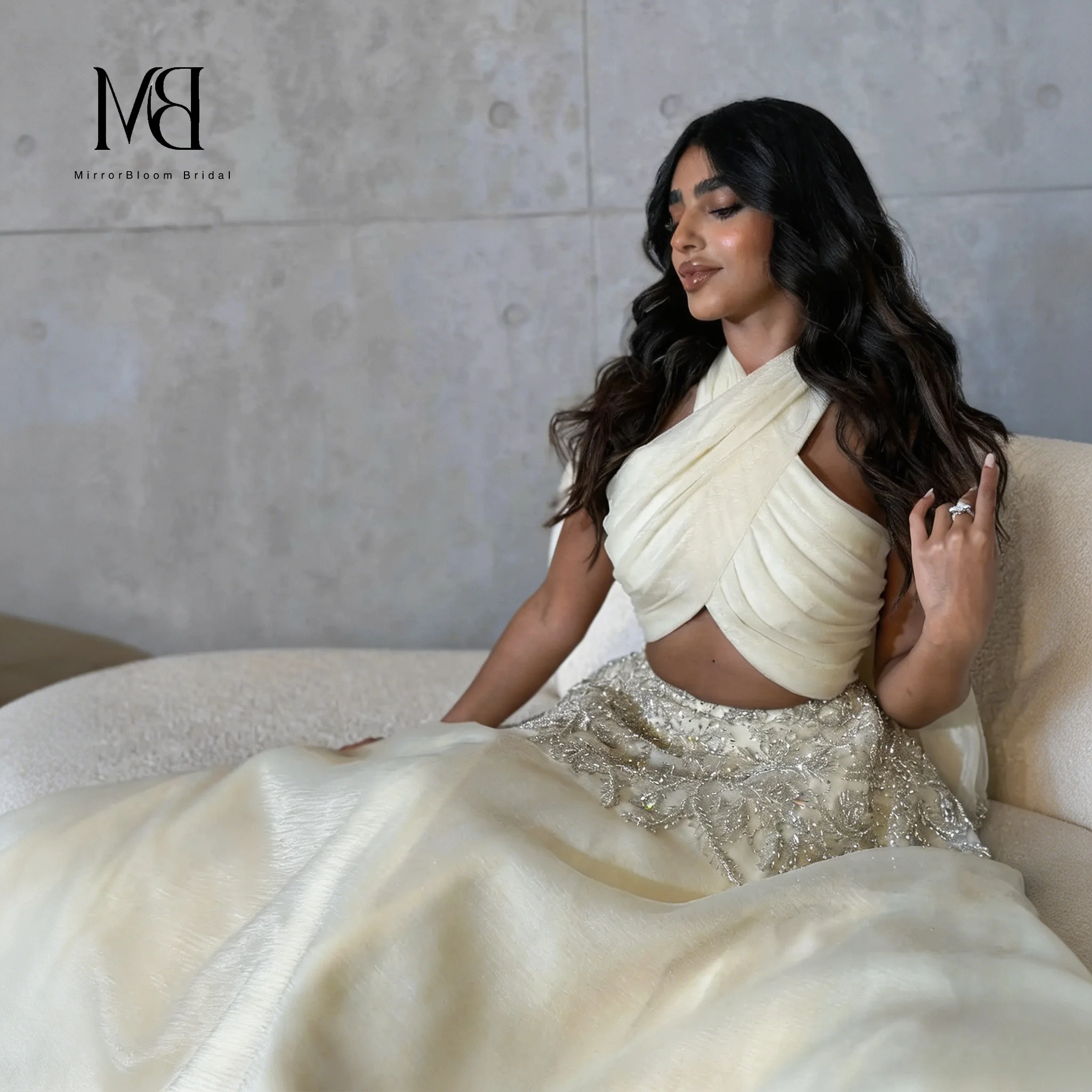 Off-white strapless A-line floor-length formal gown featuring exquisite sequin embroidery and a cut-out waist