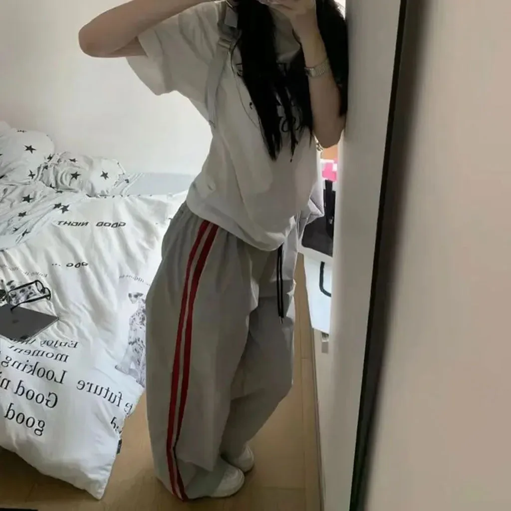 กางเกงกีฬาลายทางหลวมๆ ลำลองสำหรับผู้หญิง กางเกงคาร์โก้บางสำหรับฤดูใบไม้ผลิและฤดูใบไม้ร่วง แจ๊สลำลอง สตรีทแดนซ์ ฮิปฮอป