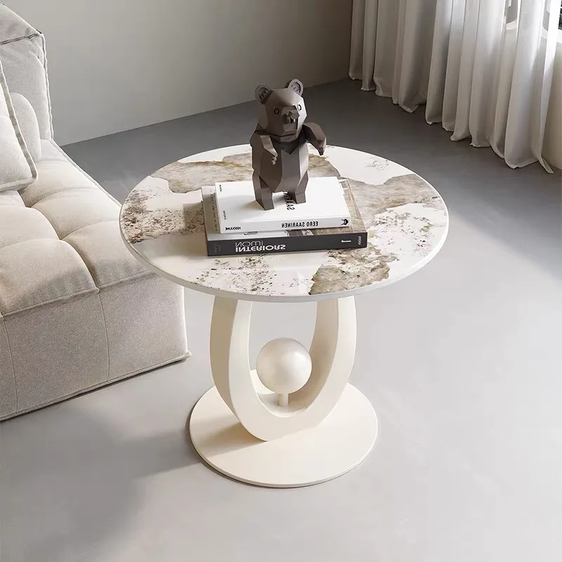 A round sintered stone side table with an artistic style hollow base living room coffee table