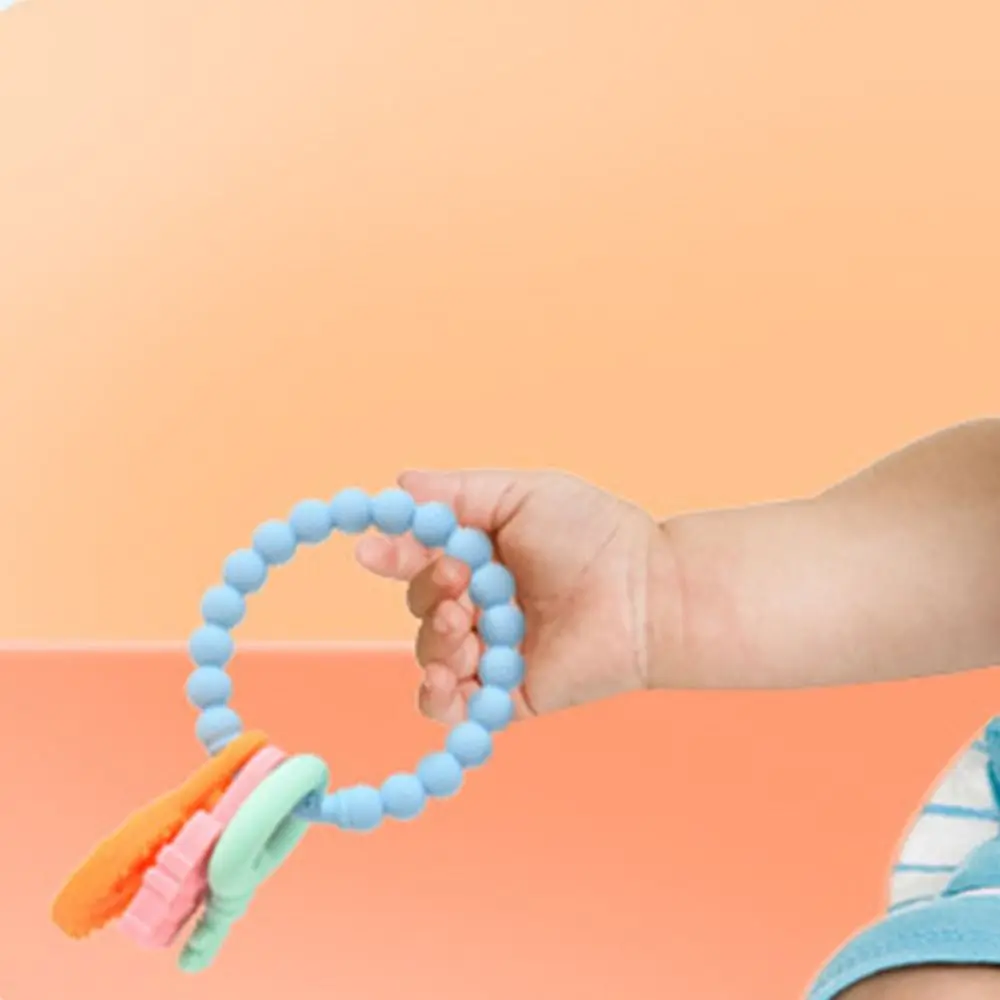 Giocattolo per la dentizione del bambino in silicone per uso alimentare Design ad anello multicolore Giocattoli per massaggiagengive per la salute del bambino Giocattoli da masticare per bambini a prova di chocking senza BPA