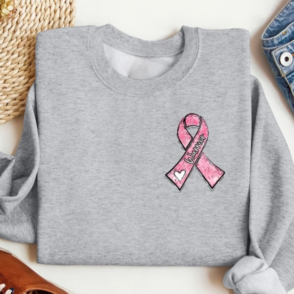 Sweat-shirt guerrier du Cancer du sein en octobre, nous portons un col rond rose, pull avec ruban rose, vêtements cadeaux pour femmes