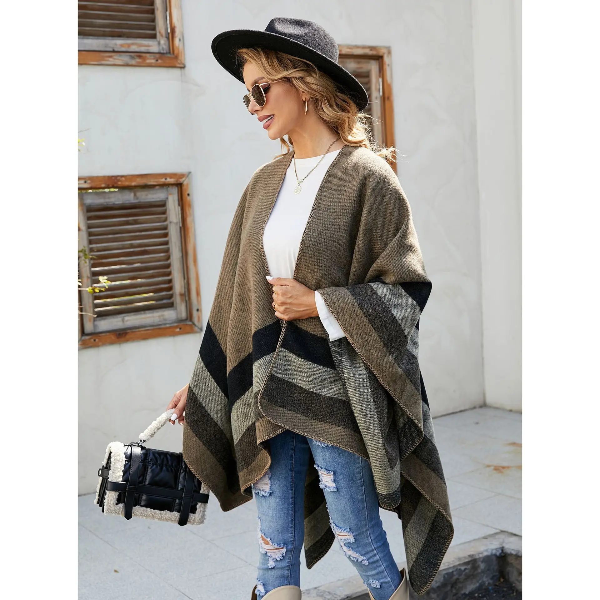 A lady\'s shawl travel with thermal striped plaid patterned imitation cashmere shawl