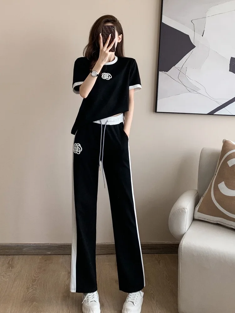

2025 Women's Sweat Suit Summer New Fashion Street Bombing Style Short Sleeve Corp Tops And Wide Leg Pants Leisure Two Piece Set