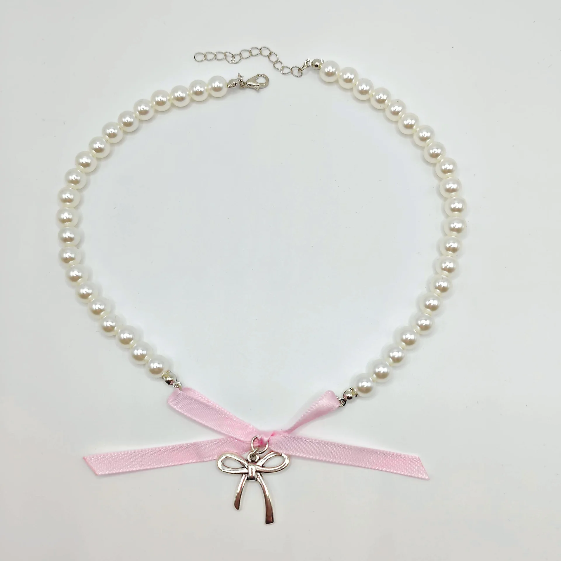 الطريق الأيمن الجديد الراقية تصميم درجة الحرارة المتخصصة شيك النمط الفرنسي الحب اللؤلؤ القوس الشريط قلادة للنساء