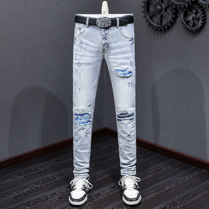 Designer's new men's jeans, washed, nostalgic, stretchy, slim fit, retro, light blue, perforated, blue patch jeans, high street