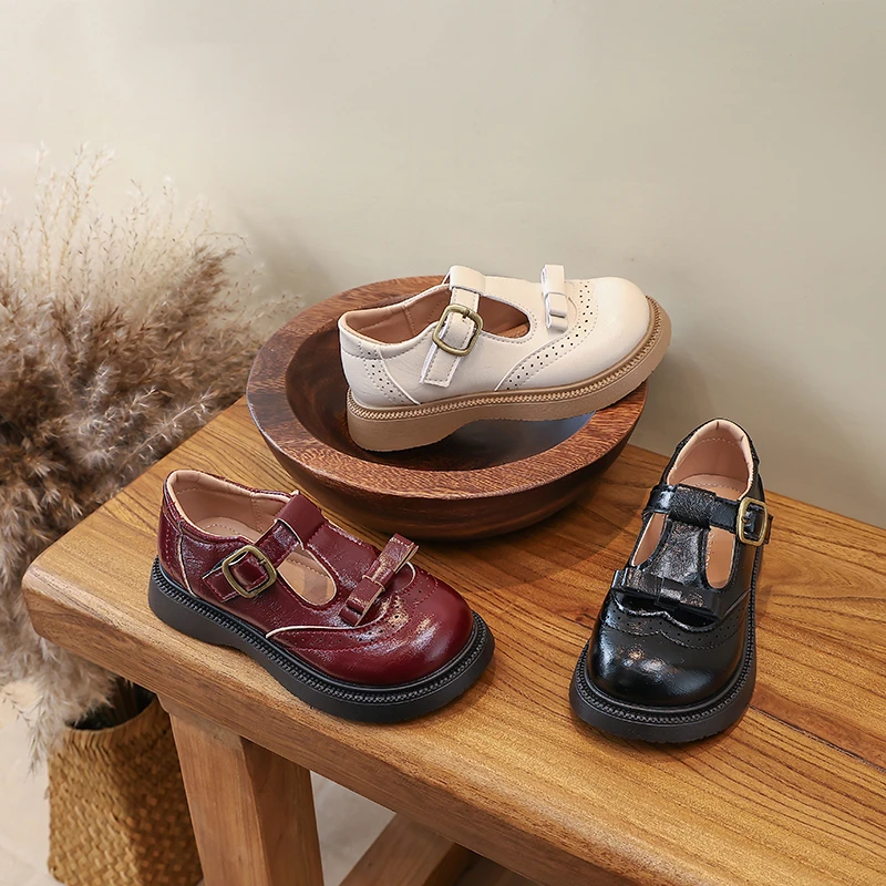 

Детские кожаные туфли с Т-образным ремешком, модные туфли без каблука для девочек, в британском стиле, однотонные, универсальные, новинка 2026 года, детские туфли для принцесс