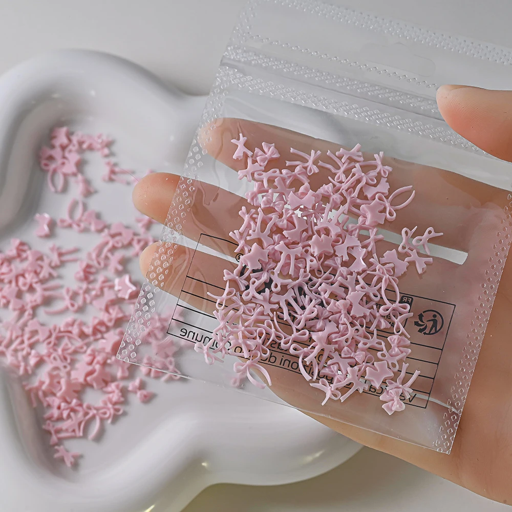100 pezzi rosa mini bowknot nail art fascino dolce nastro bowknot design scavato nail art strass kawaii papillon manicure parte