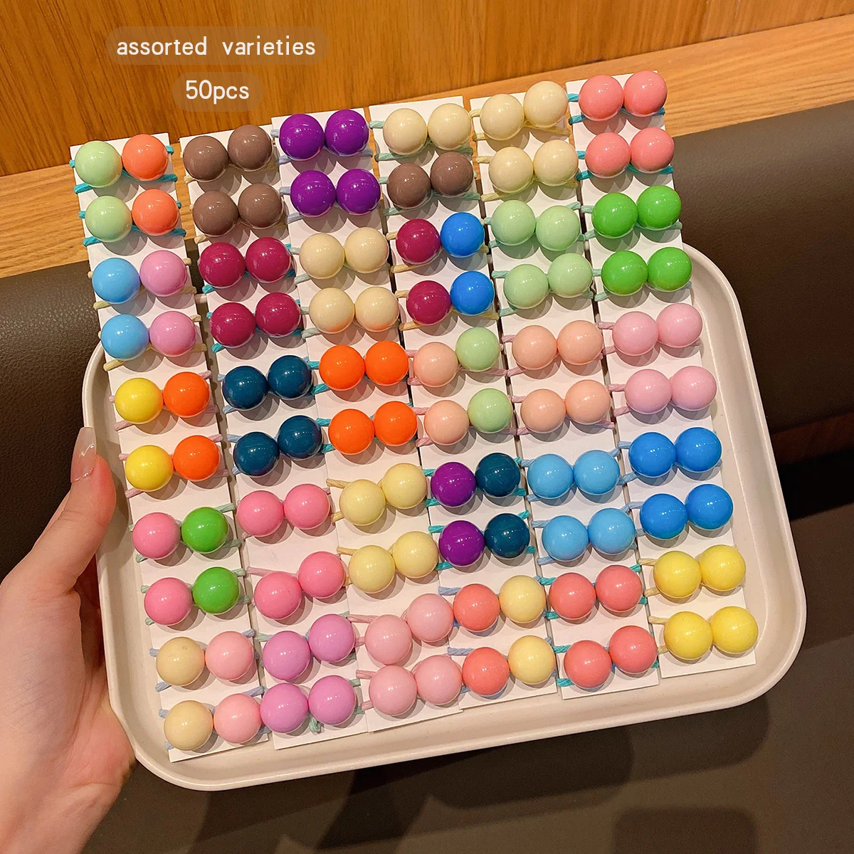 50 button style double ended rubber bands with colorful random hair loops suitable for daily use as hair accessories