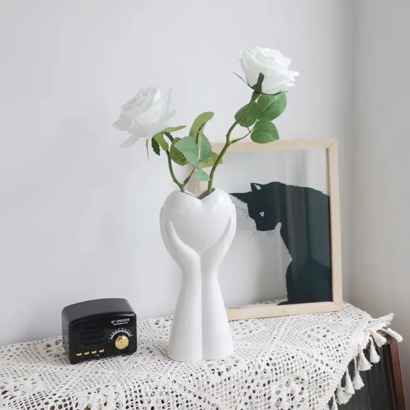 Modern Heart-Holding Ceramic Vase, Glossy Smooth Finish, High-Fired Floral Display, Elegant Decor Piece, Sentimental Room Accent